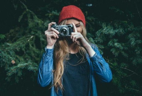 A photographer holding a camera